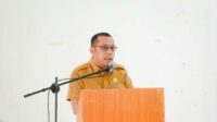 Sekda Humbahas Chiristison Rudianto Marbun, saat menyampaikan sambutan dalam Forum Konsultasi Publik RKPD Kabupaten Humbahas tahun 2026.